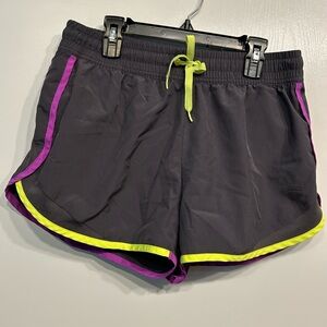 Fila athletic shorts size XS. Gray with purple and green trim.